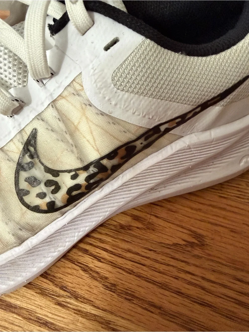 Nike Women’s White Athletic Sneakers with Leopard-Print Swoosh